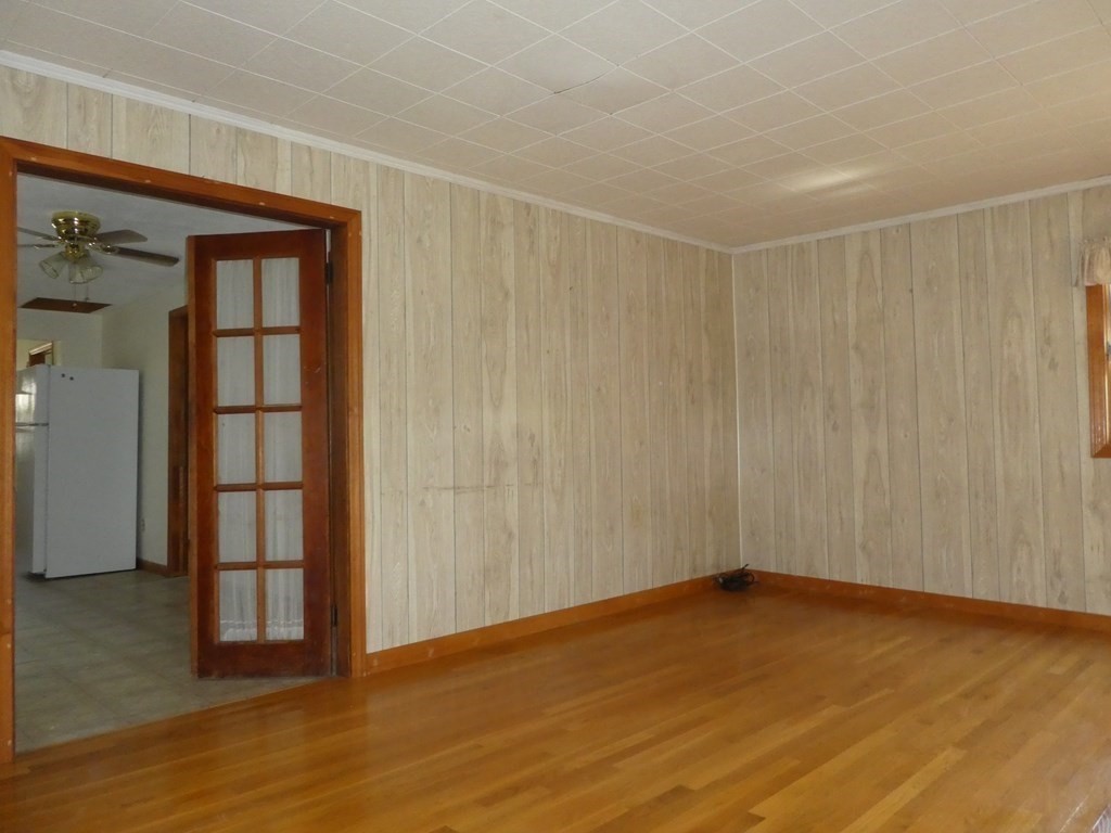 8 Shore Avenue Wareham, MA 02571 - Photo 3 of 18 a view of an empty room with wooden floor and closet