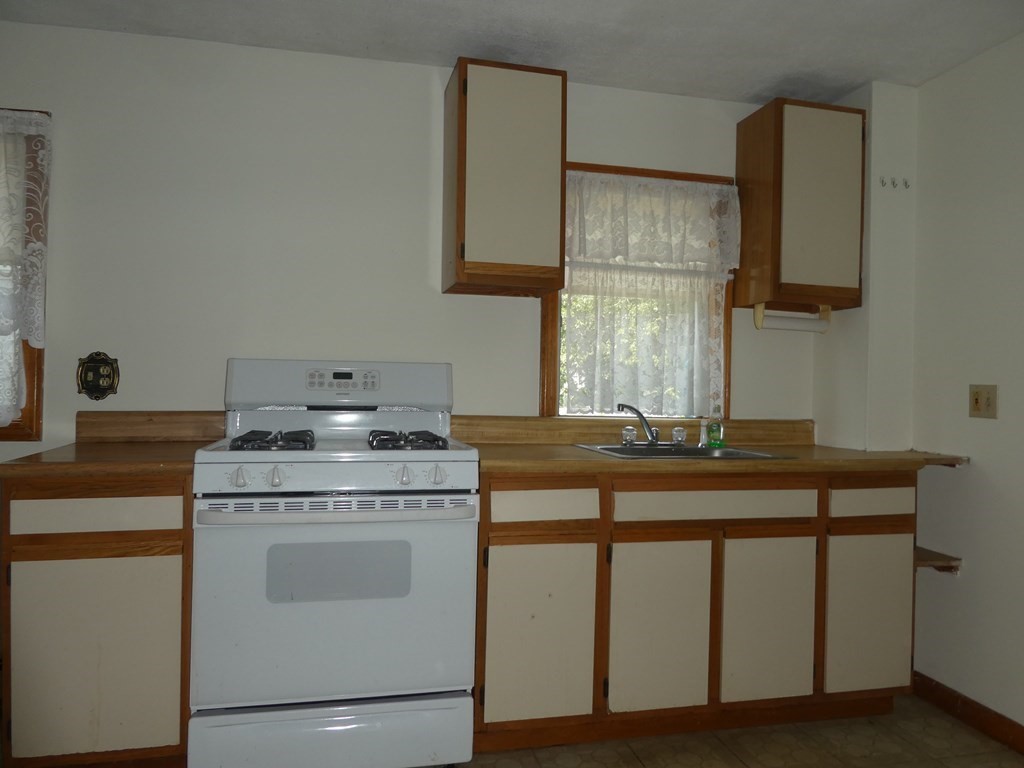 8 Shore Avenue Wareham, MA 02571 - Photo 6 of 18 a view of cabinets stove and oven