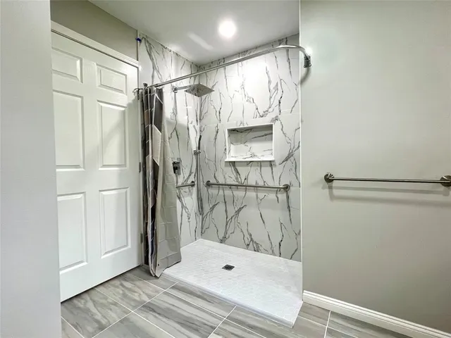 a bathroom with a sink toilet and a mirror