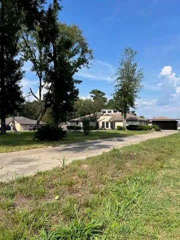 a view of a house with a big yard