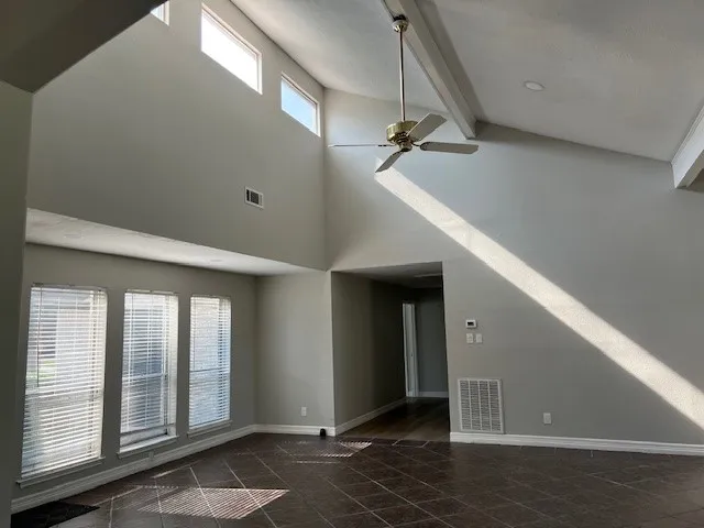 a view of an empty room with a fireplace