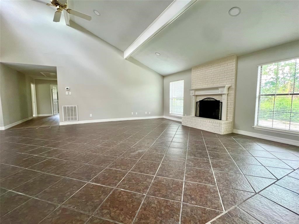 14221 Horseshoe Bend Conroe, TX 77384 - Photo 9 of 21 a view of an empty room with a fireplace