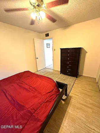 a view of a swimming pool with lawn chairs