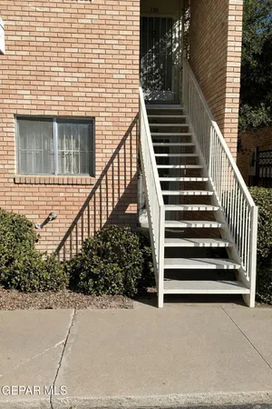 a view of a door and a window