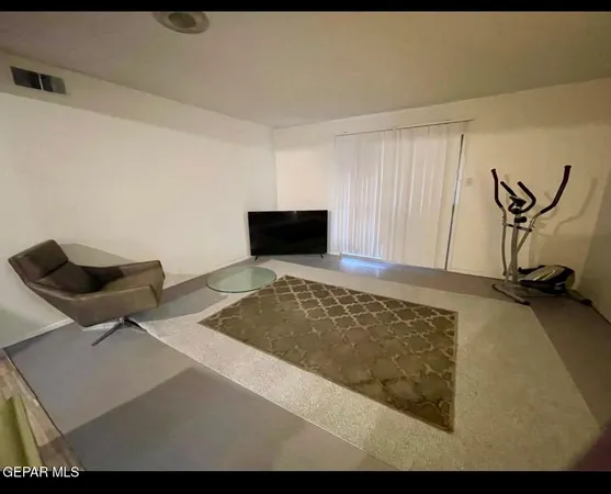 a kitchen with a refrigerator and a stove