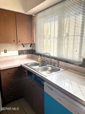 a stove top oven sitting inside of a kitchen