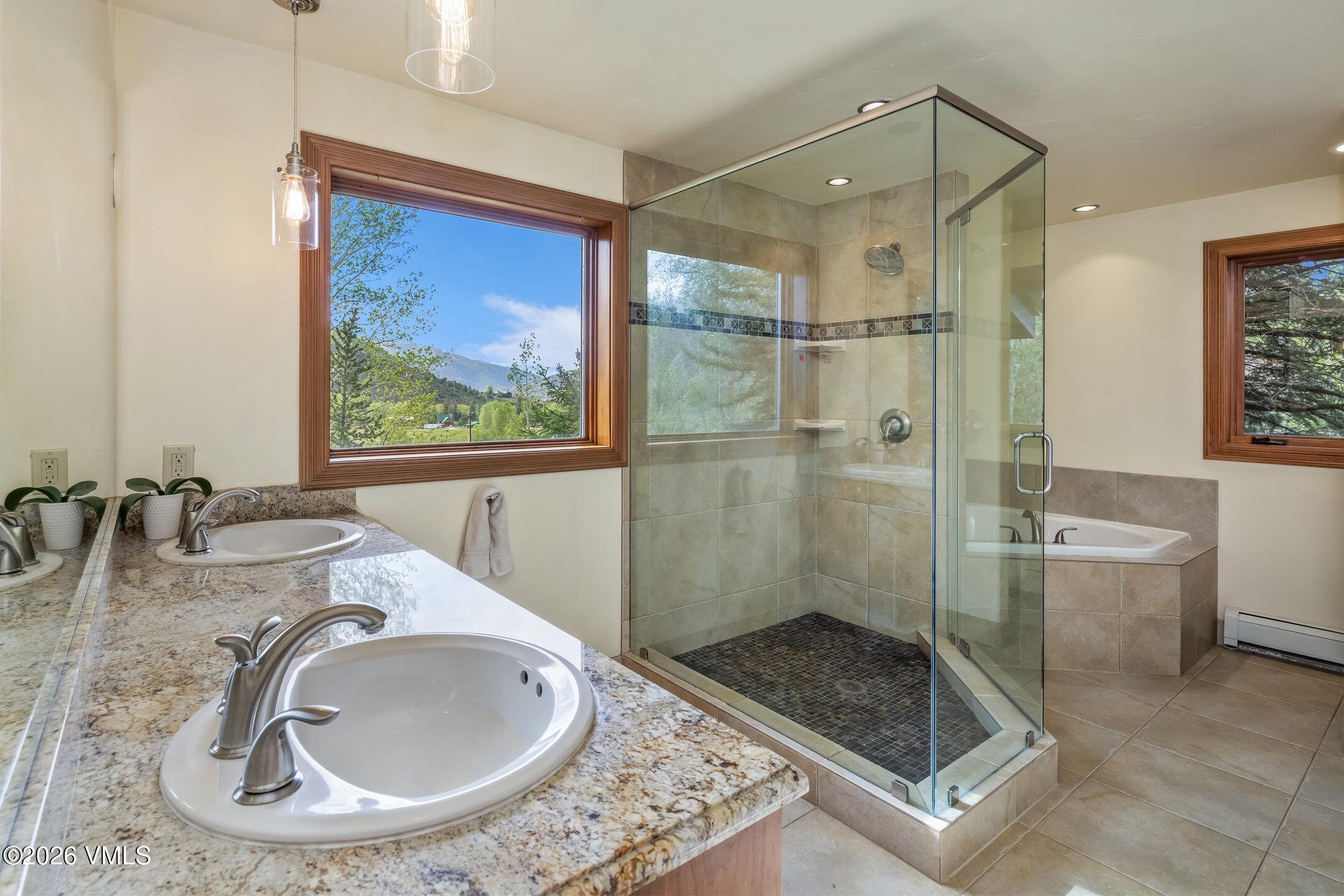 321 Meile Lane Edwards, CO 81632 - Photo 17 of 44 a bathroom with a granite countertop sink a mirror and a shower