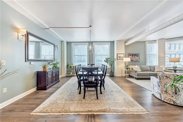 a view of a dining room with furniture window and wooden floor