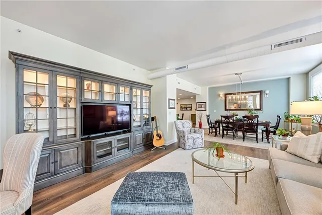 a living room with a large window and a flat screen tv