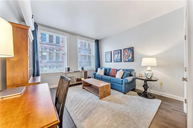 a living room with furniture and a large window