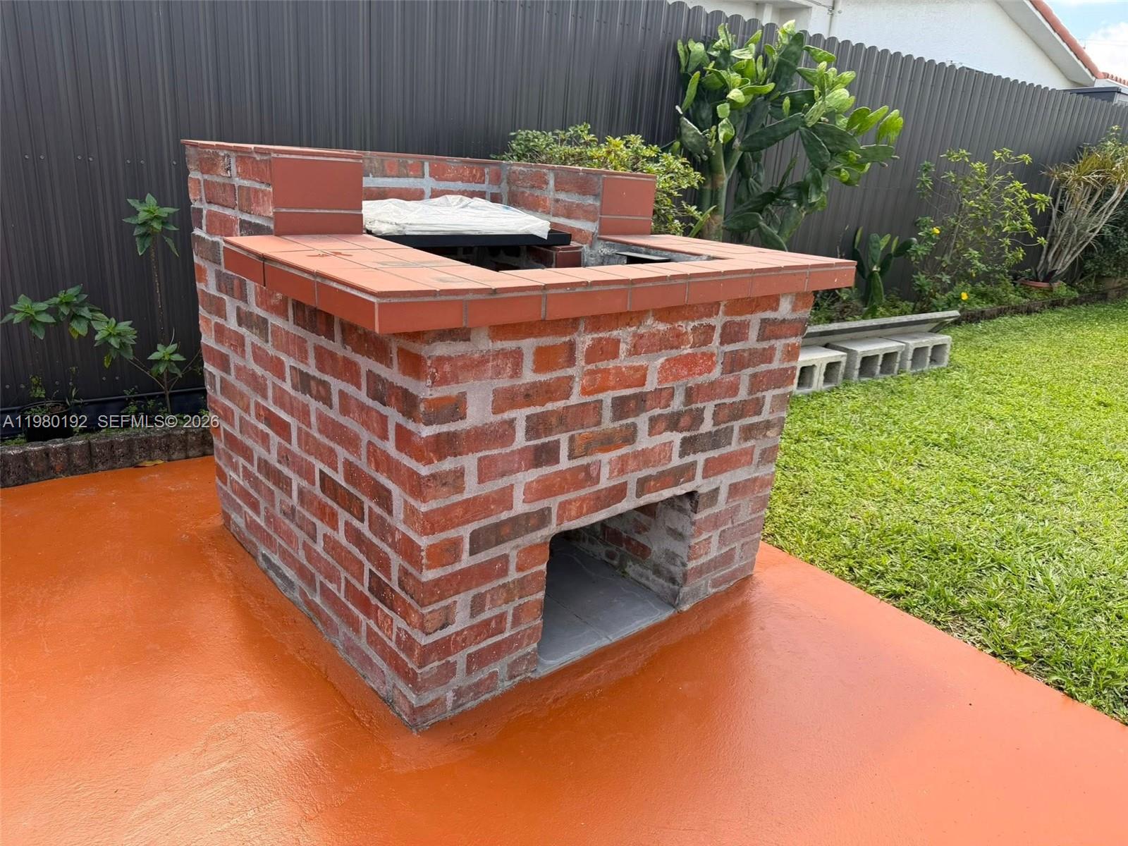 4161 Southwest 97th Place Miami, FL 33165 - Photo 16 of 19 a view of a chairs and table in the patio