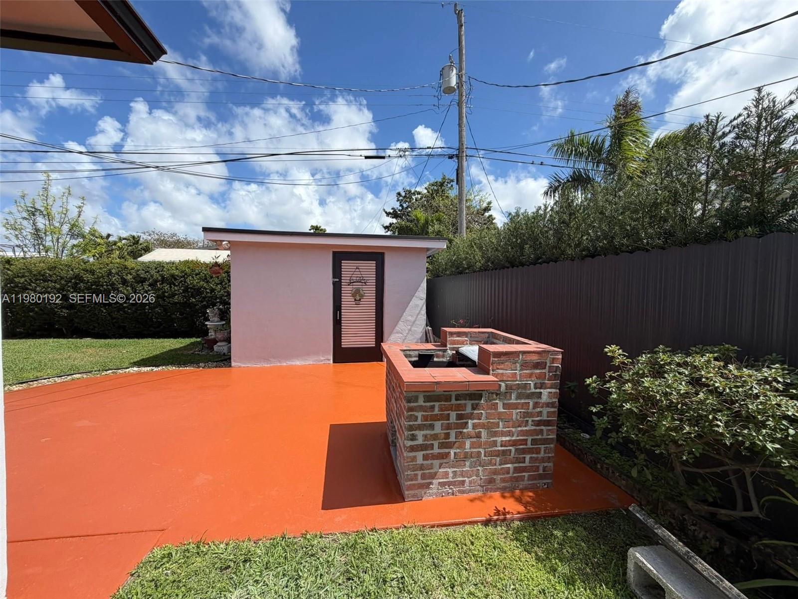 4161 Southwest 97th Place Miami, FL 33165 - Photo 18 of 19 a backyard of a house with lots of green space