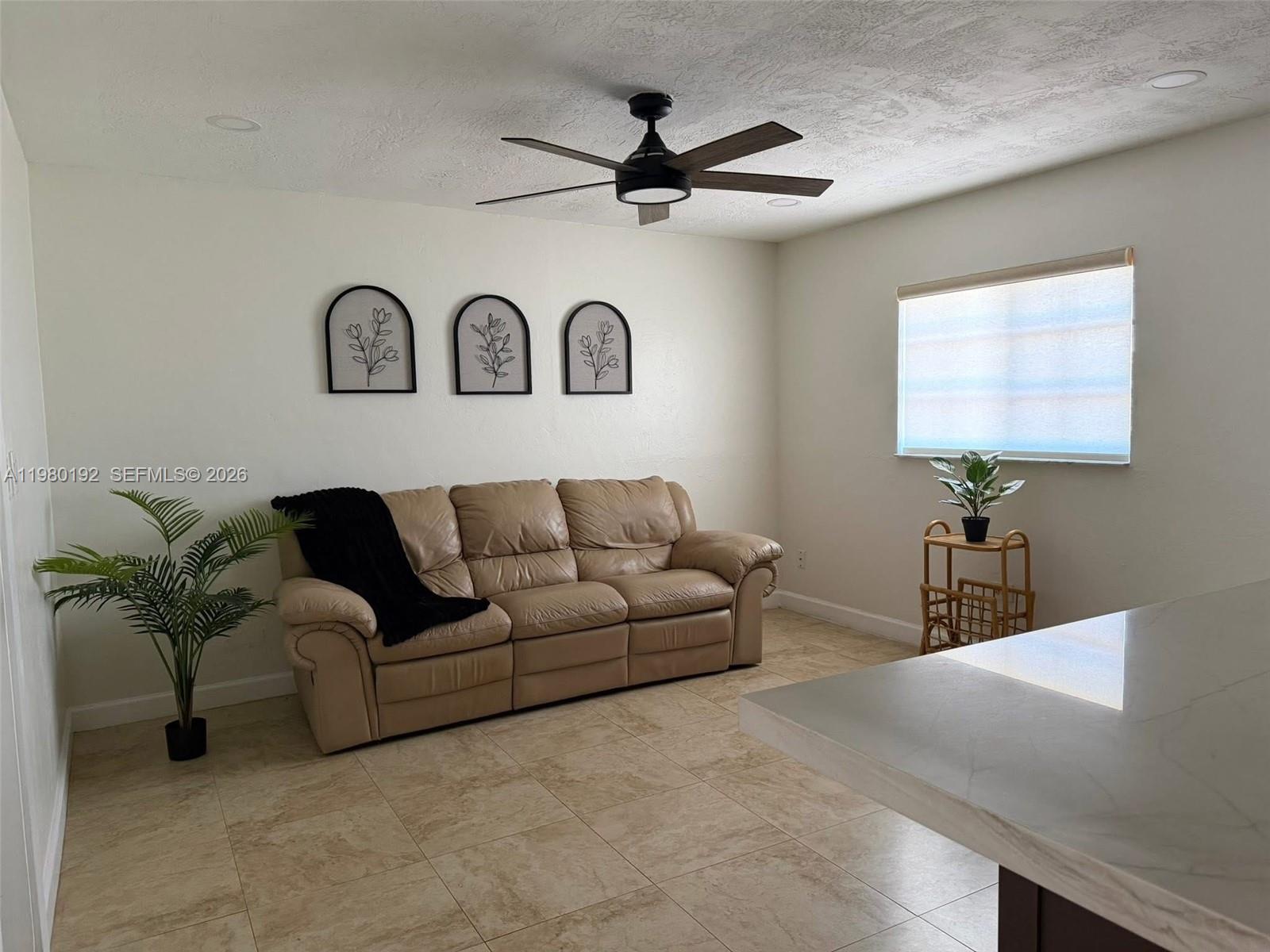 4161 Southwest 97th Place Miami, FL 33165 - Photo 4 of 19 a living room with furniture
