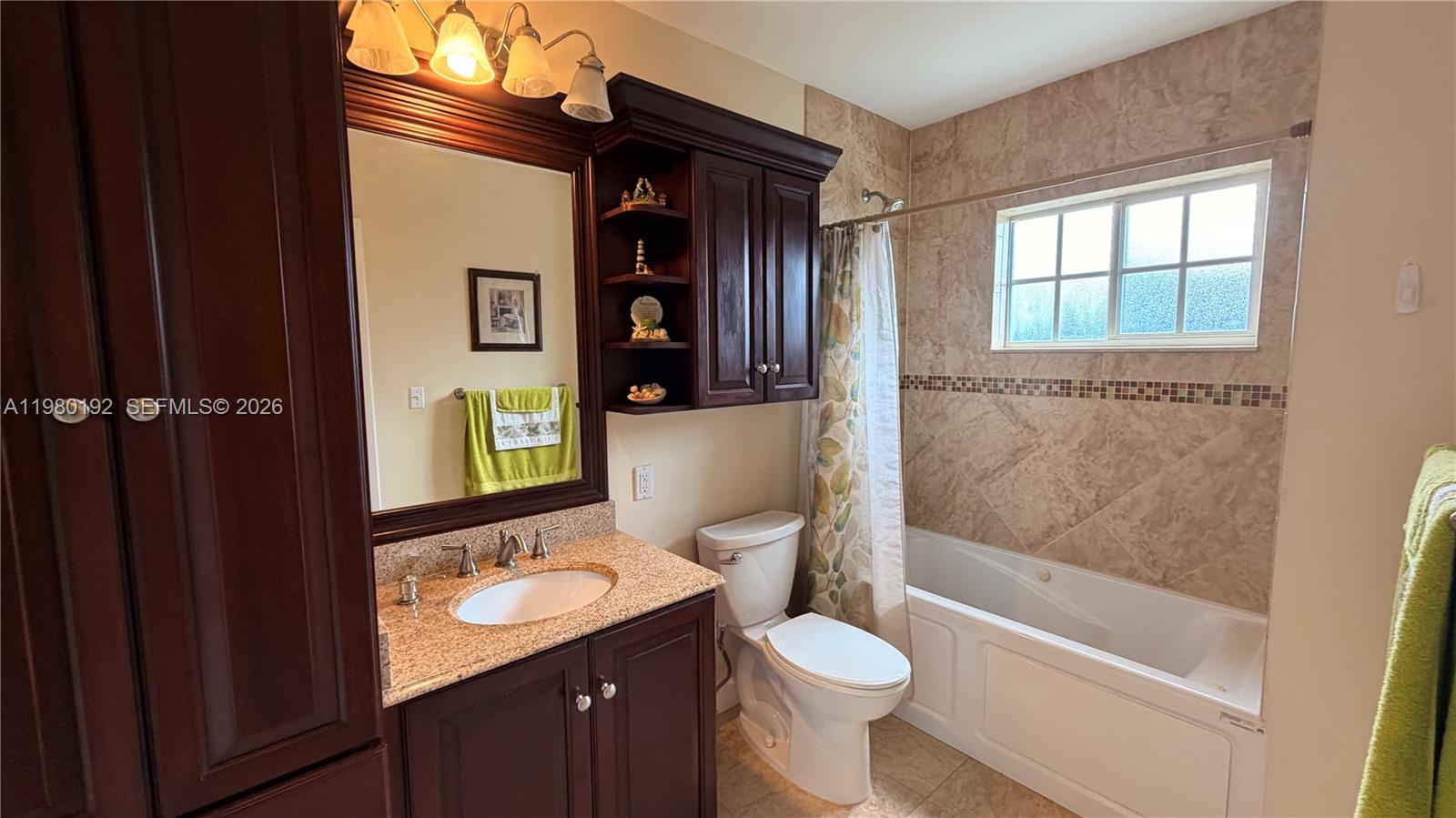 4161 Southwest 97th Place Miami, FL 33165 - Photo 9 of 19 a bathroom with a sink a toilet and shower