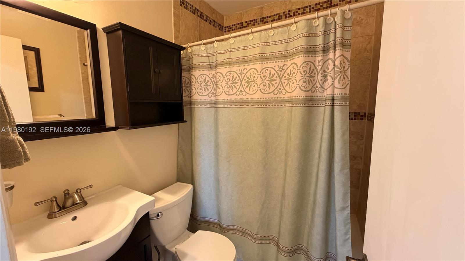 4161 Southwest 97th Place Miami, FL 33165 - Photo 10 of 19 a bathroom with a sink and a mirror