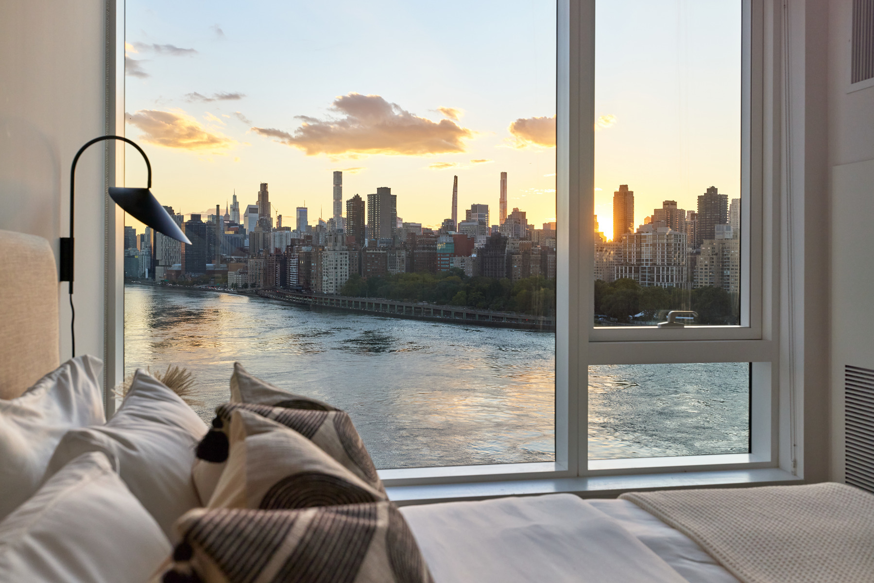 a room with furniture and a floor to ceiling window