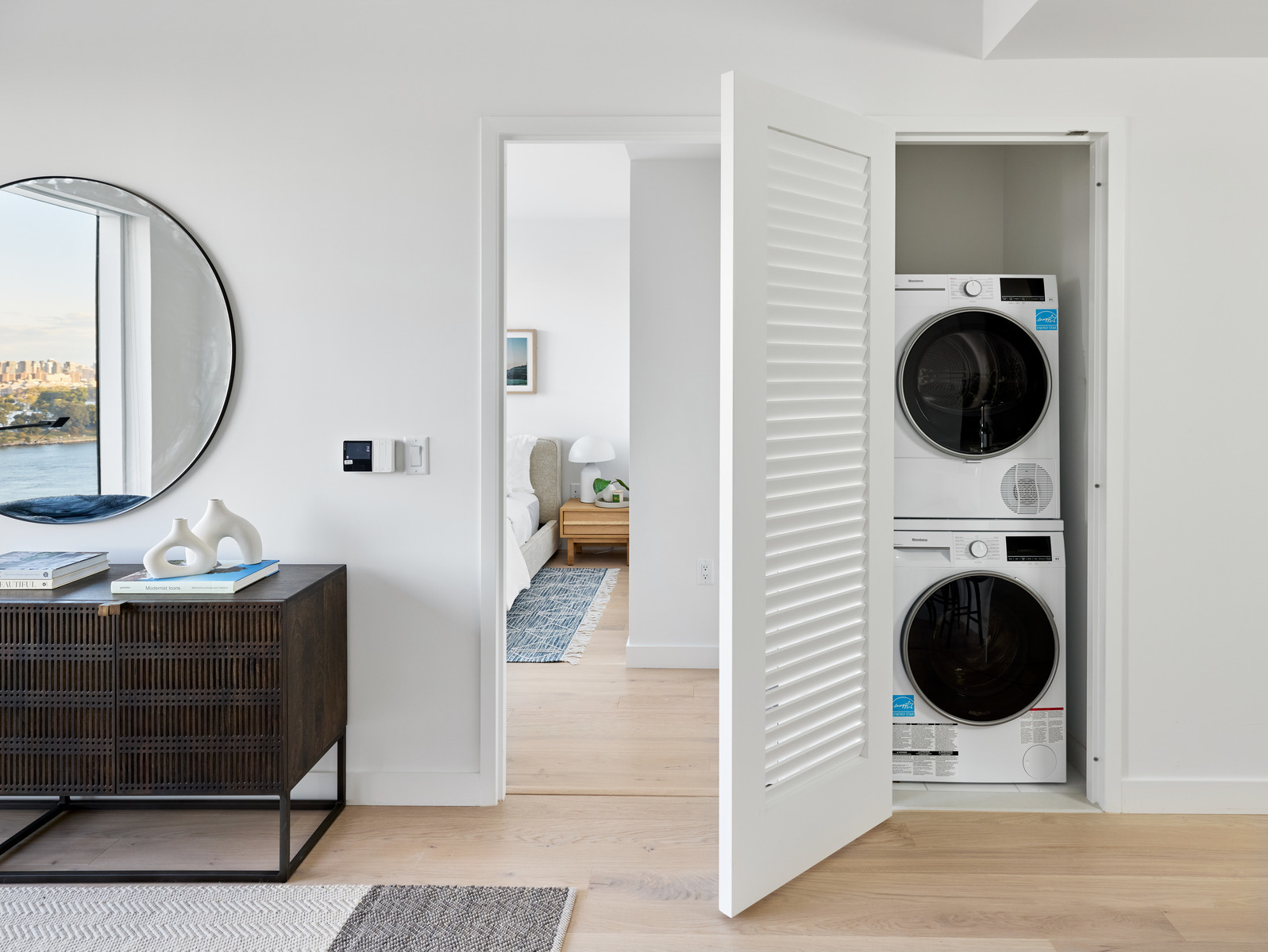 20 Halletts Point, Unit 21205 Queens, NY 11102 - Photo 11 of 46 a hallway with a washer and dryer