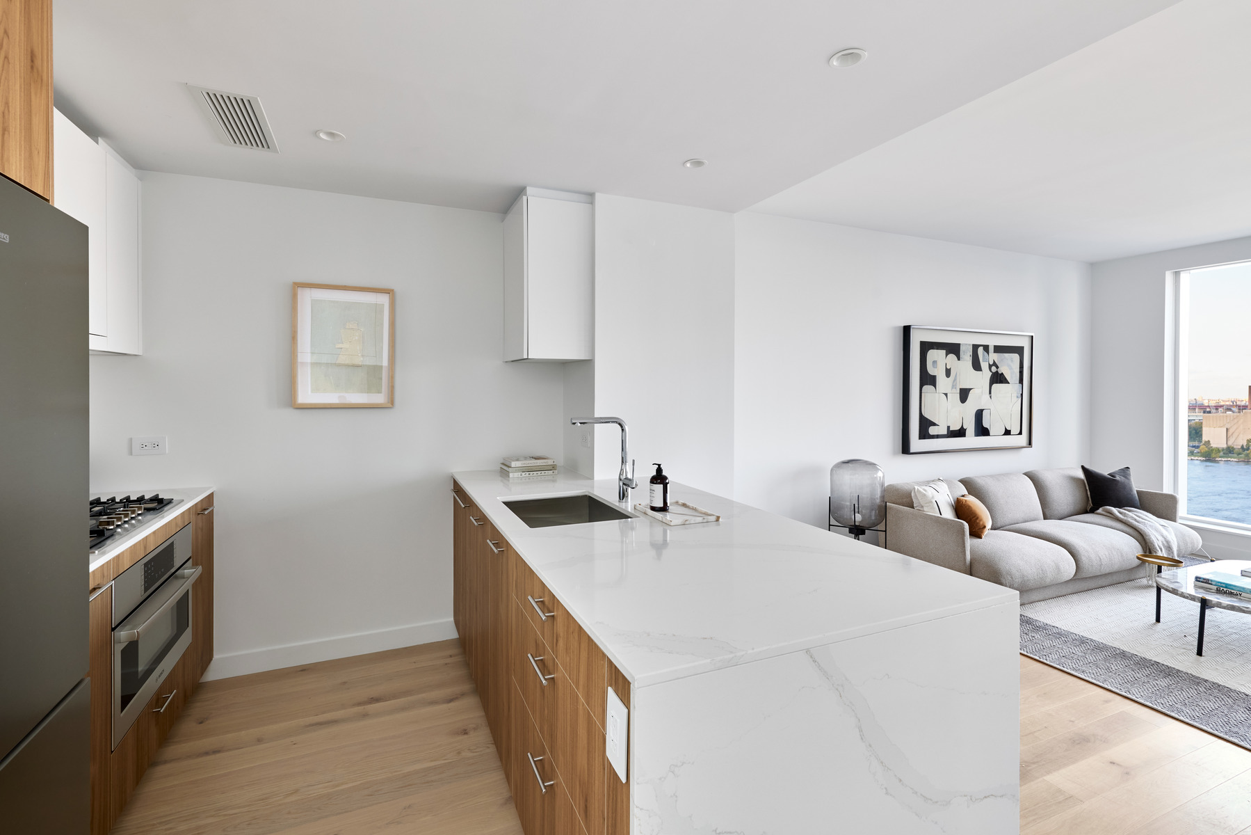 20 Halletts Point, Unit 21205 Queens, NY 11102 - Photo 12 of 46 a view of a kitchen with a sink cabinets and window