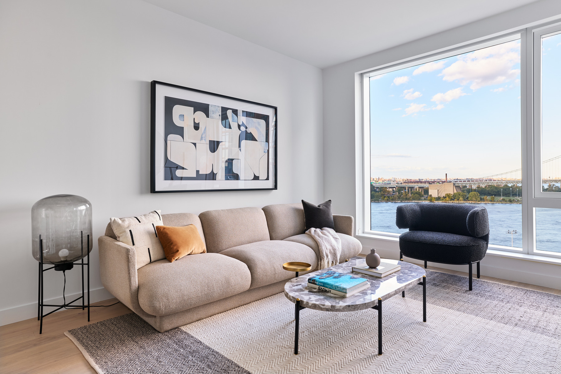 20 Halletts Point, Unit 21205 Queens, NY 11102 - Photo 22 of 46 a living room with furniture and a large window