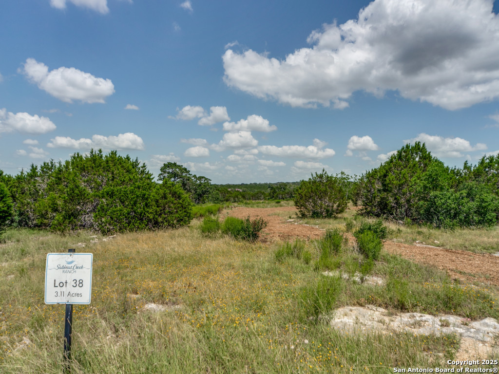 Lot 38 Sabinas Creek Ranch Boerne, TX 78006 - Photo 12 of 13 a view of a lake in between the bunch of trees