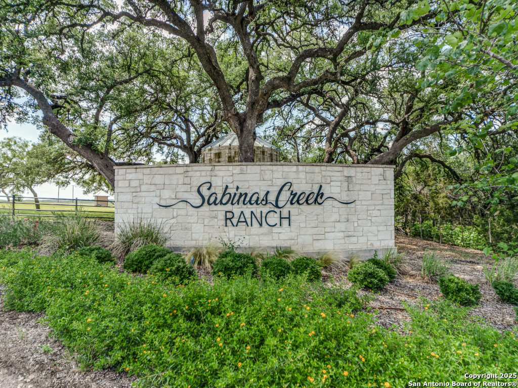 Lot 38 Sabinas Creek Ranch Boerne, TX 78006 - Photo 2 of 13 a sign of golf club on a wall under a tree