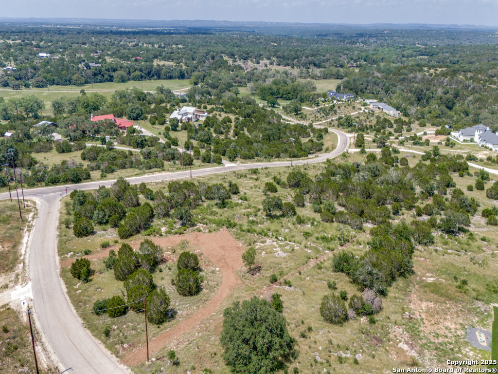 Lot 38 Sabinas Creek Ranch Boerne, TX 78006 - Photo 3 of 13 an aerial view of a houses with a yard