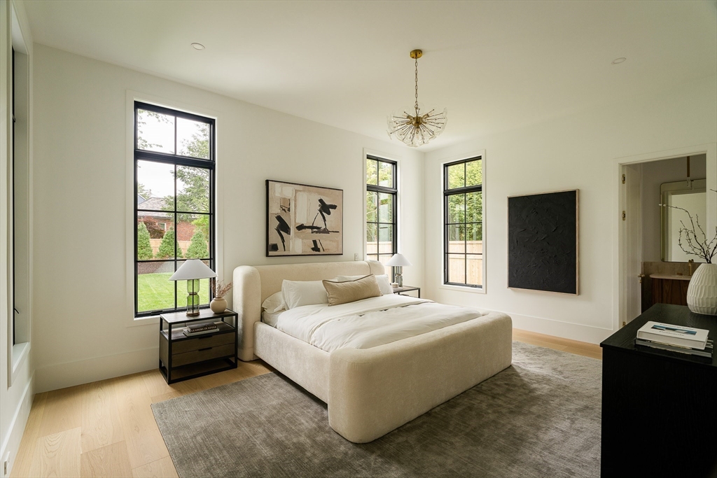 19 Bonnybrook Road Newton, MA 02468 - Photo 20 of 42 a spacious bedroom with a bed and wooden floor
