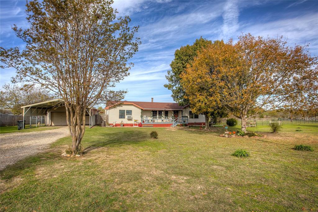 a view of a house with a big yard