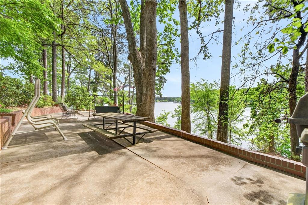 149 Pine Bluff Trail Jackson, GA 30233 - Photo 13 of 59 a view of a backyard with large trees