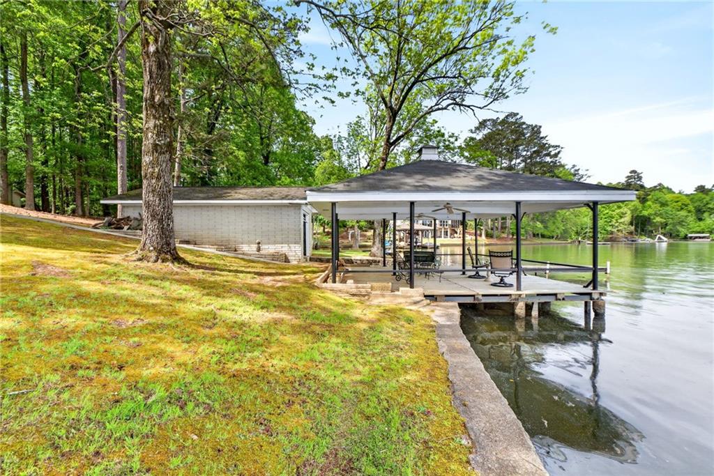 149 Pine Bluff Trail Jackson, GA 30233 - Photo 15 of 59 a view of a swimming pool with a patio
