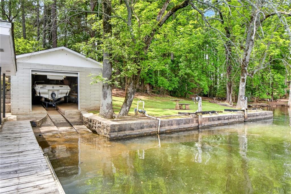 149 Pine Bluff Trail Jackson, GA 30233 - Photo 19 of 59 a view of a swimming pool with a patio