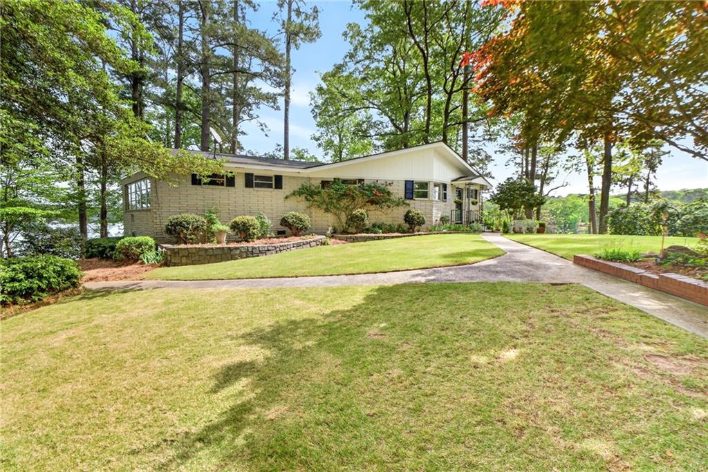 149 Pine Bluff Trail Jackson, GA 30233 - Photo 2 of 59 a view of a house with a yard and tree s