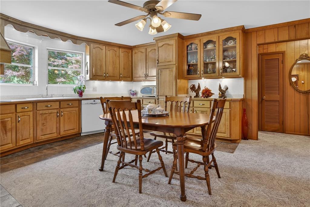 149 Pine Bluff Trail Jackson, GA 30233 - Photo 29 of 59 a view of a dining room with furniture window and wooden floor