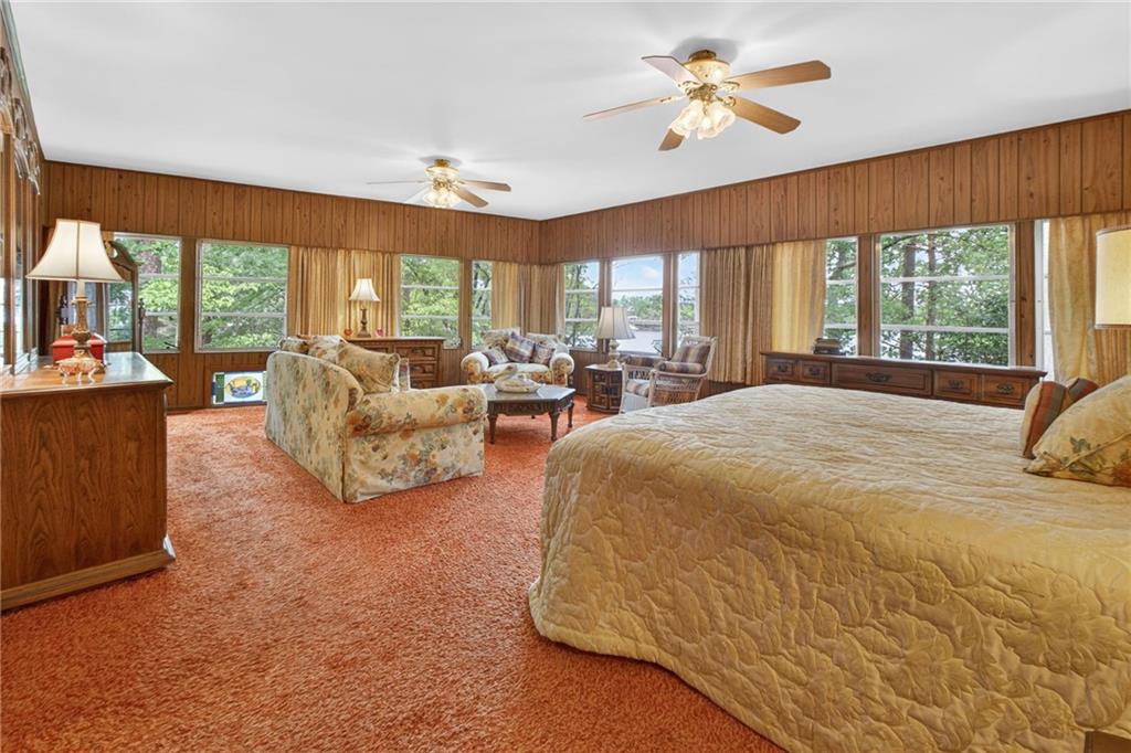 149 Pine Bluff Trail Jackson, GA 30233 - Photo 36 of 59 a spacious bedroom with a bed and a couch