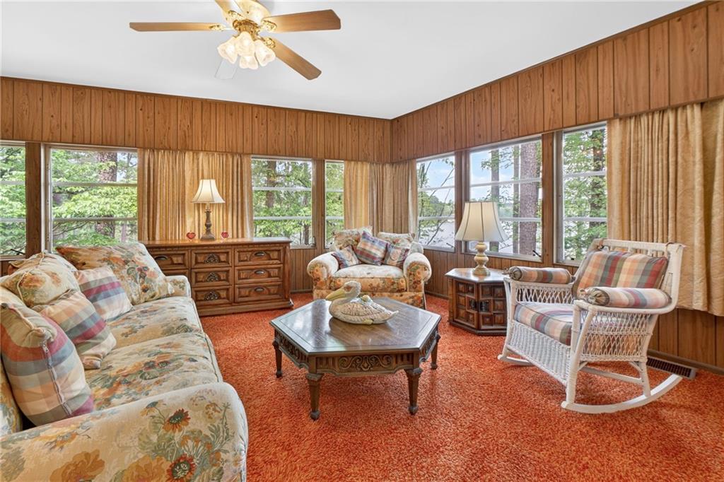 149 Pine Bluff Trail Jackson, GA 30233 - Photo 38 of 59 a living room with furniture and a large window