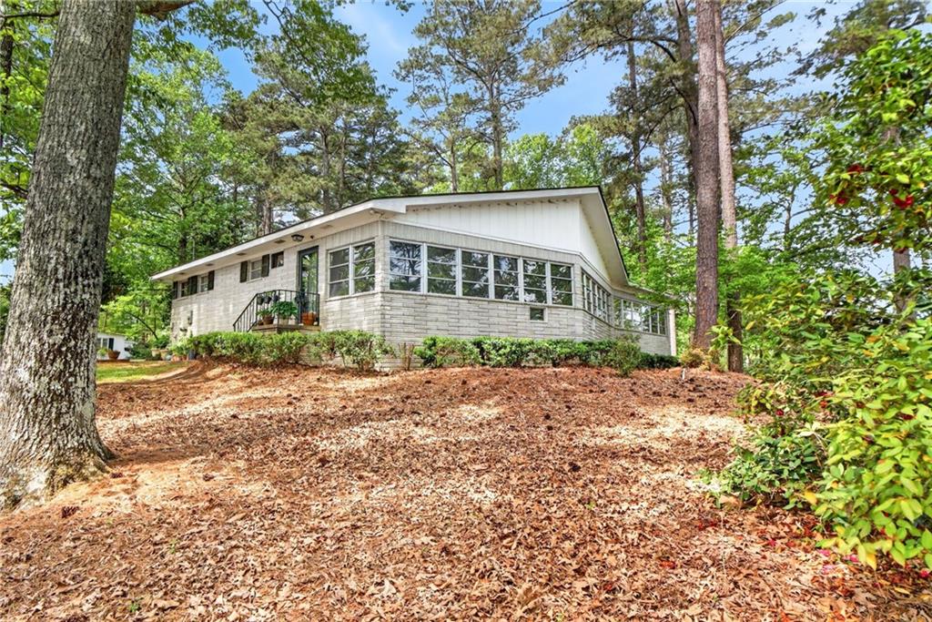 149 Pine Bluff Trail Jackson, GA 30233 - Photo 48 of 59 a front view of a house with a garden