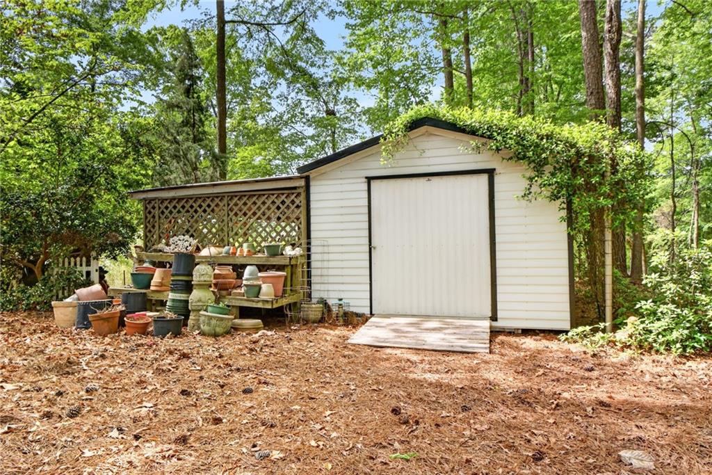 149 Pine Bluff Trail Jackson, GA 30233 - Photo 55 of 59 a backyard of a house with barbeque oven and outdoor seating