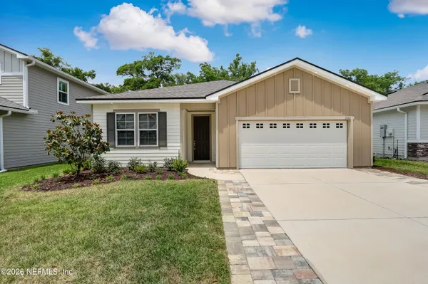 a view of a house with a yard