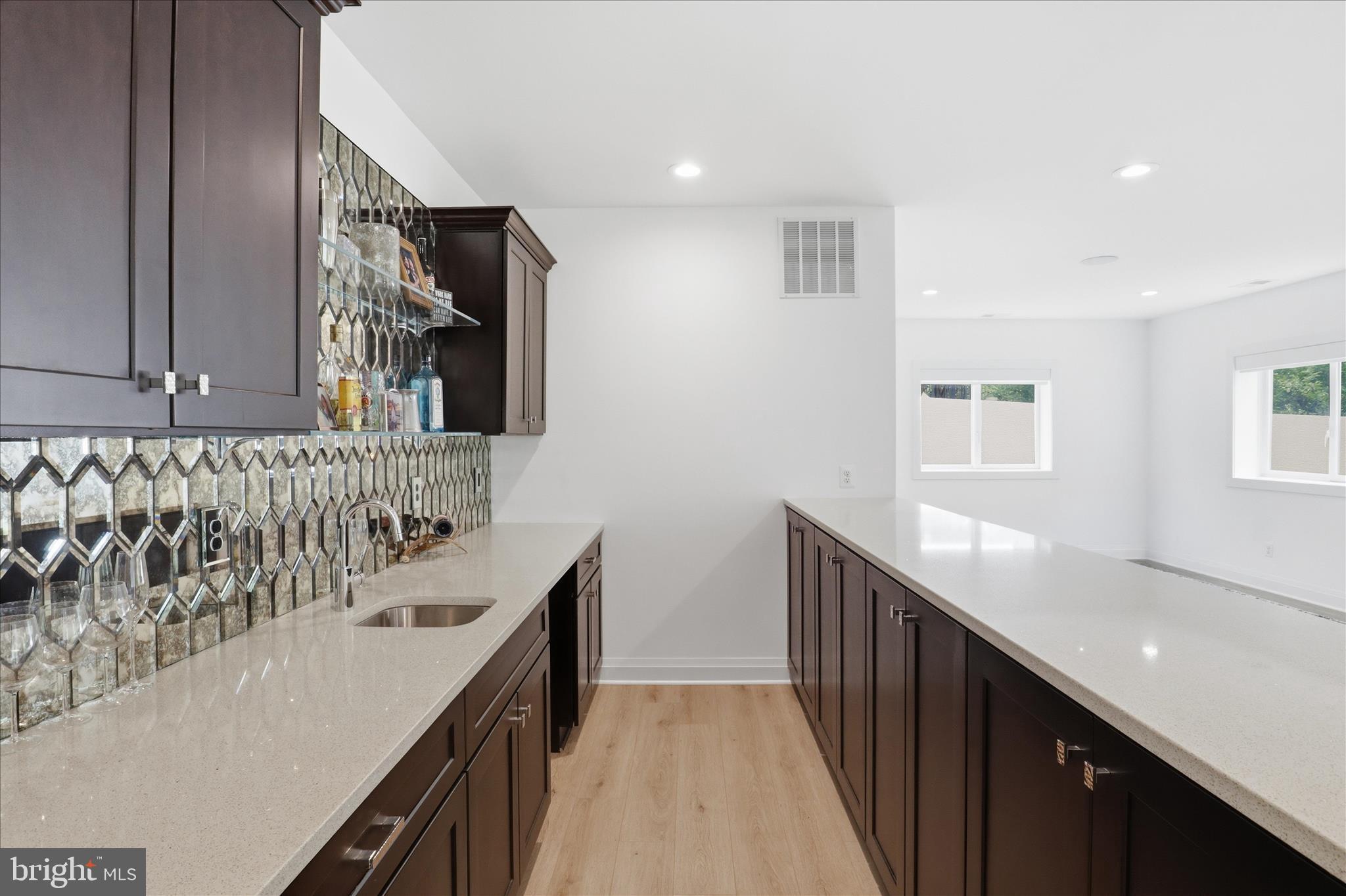 202 Branch Road Southeast Vienna, VA 22180 - Photo 49 of 59 a kitchen with a sink and cabinets