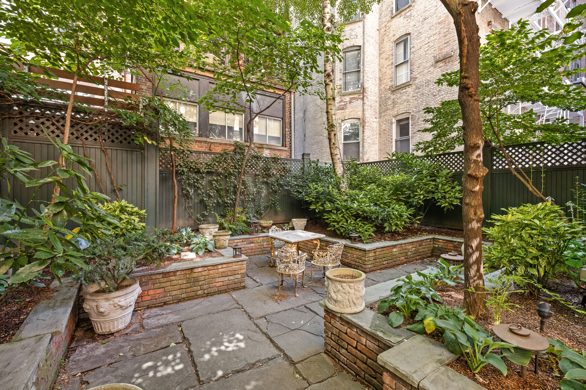 11 Gramercy Park South Manhattan, NY 10003 - Photo 11 of 27 a view of a patio with chair and table and chairs and potted plants