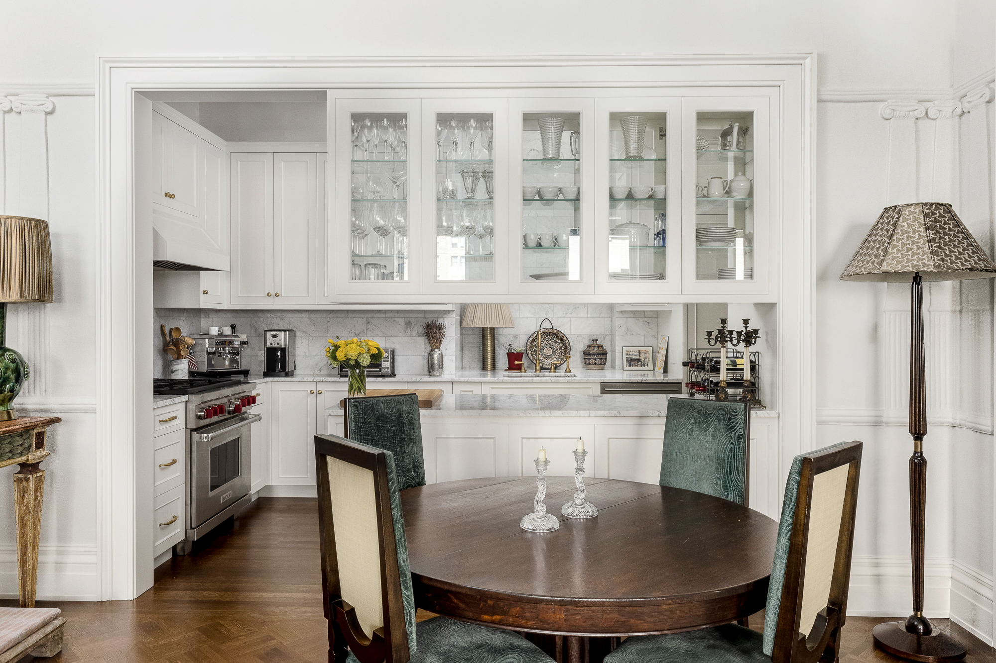 11 Gramercy Park South Manhattan, NY 10003 - Photo 16 of 27 a kitchen with stainless steel appliances granite countertop a stove a refrigerator a kitchen island a stove a table and chairs