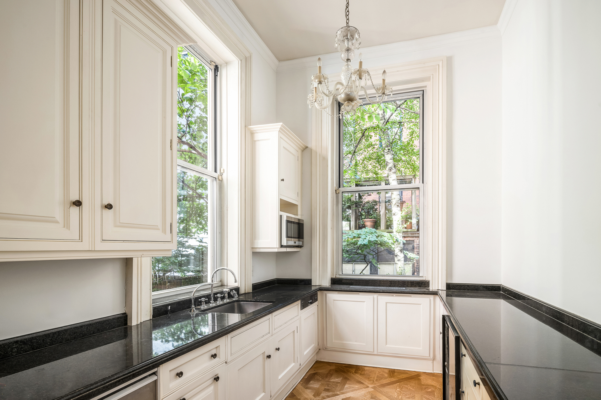 11 Gramercy Park South Manhattan, NY 10003 - Photo 4 of 27 a kitchen with granite countertop a stove a sink and a window