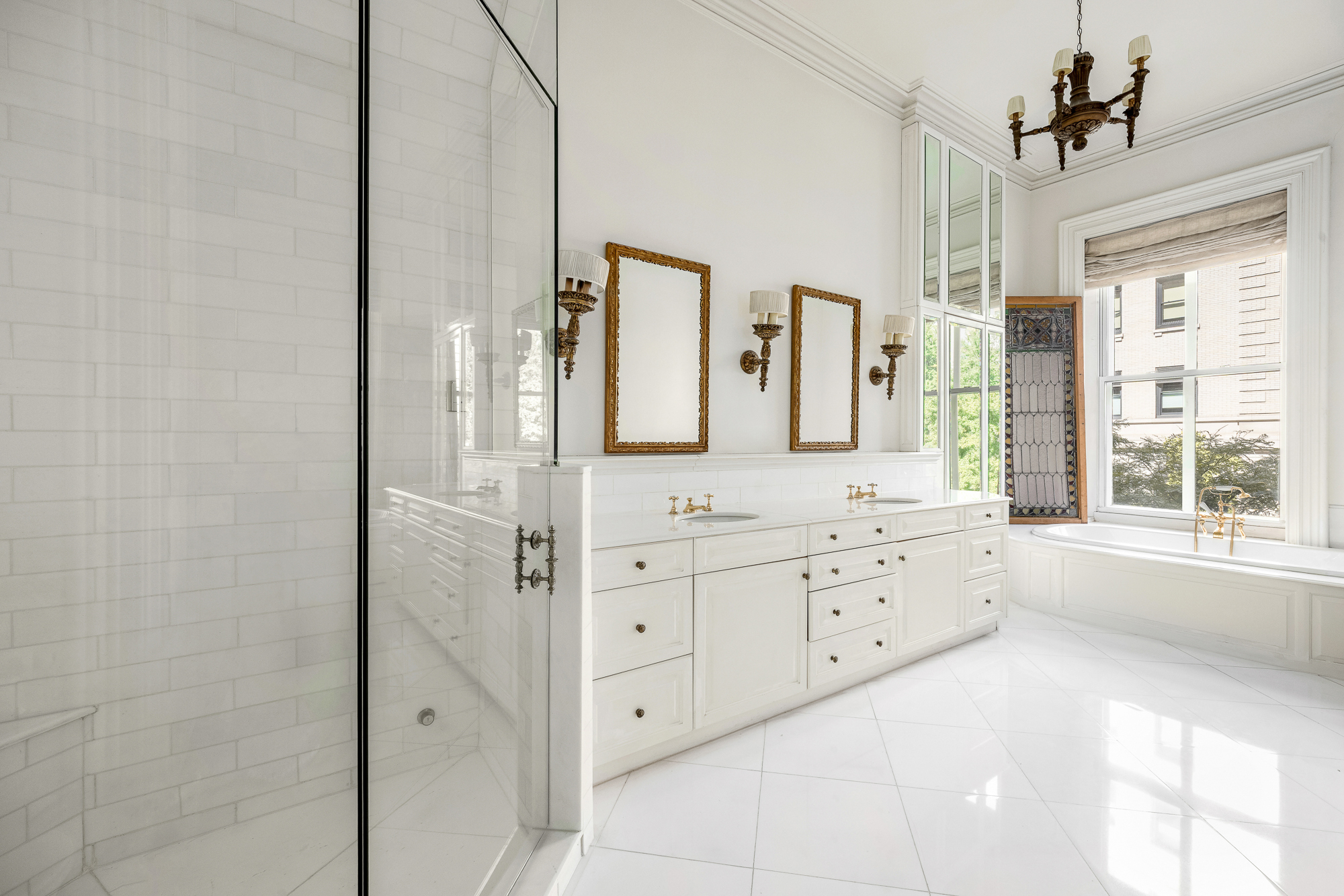 11 Gramercy Park South Manhattan, NY 10003 - Photo 7 of 27 a bathroom with a granite countertop sink two mirror and a bathtub