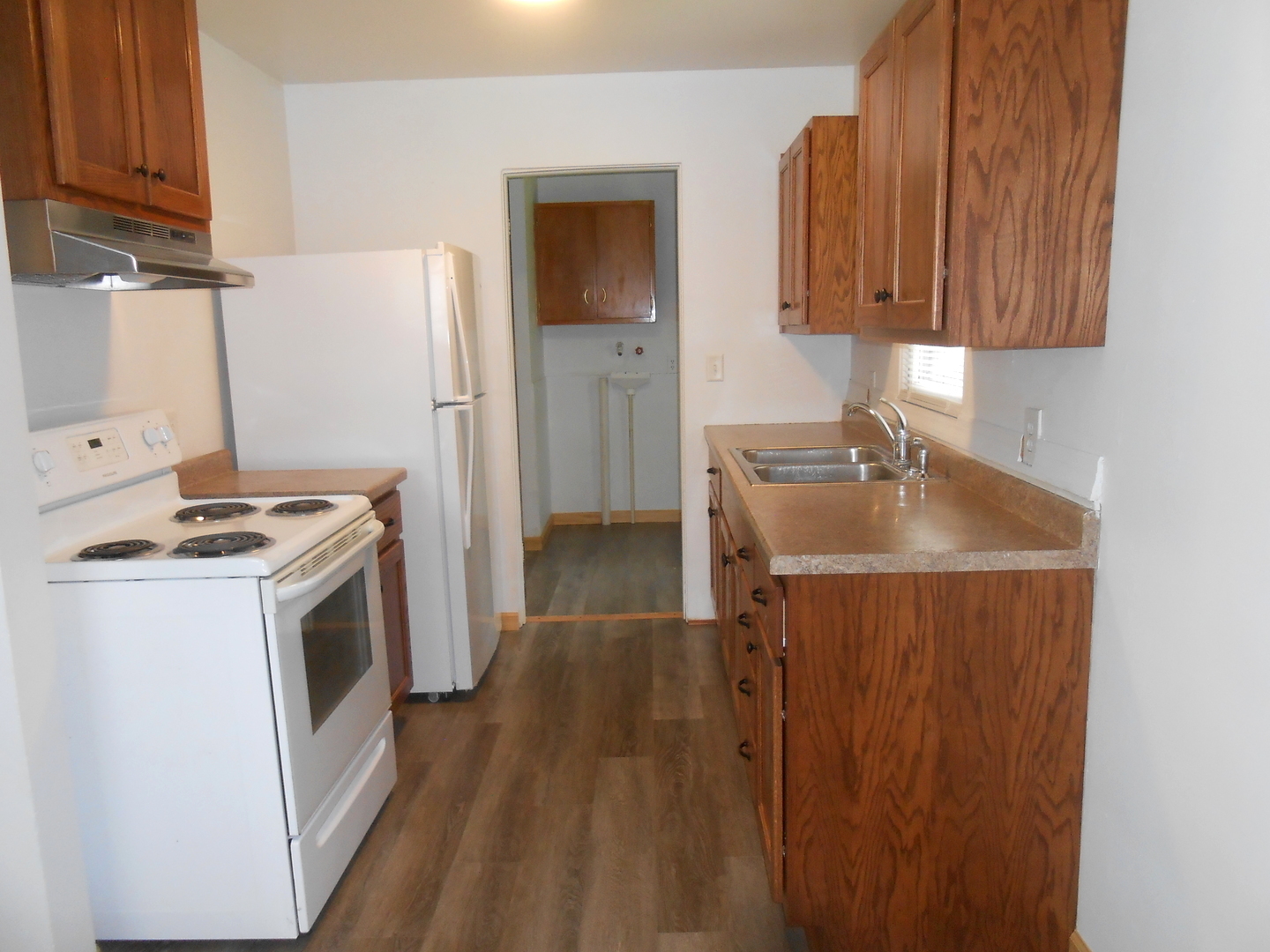 1955-65 West Southmor Road Morris, IL 60450 - Photo 5 of 12 a kitchen with a sink a stove and refrigerator