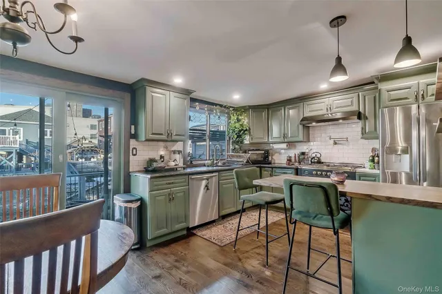 a kitchen with sink cabinets and window