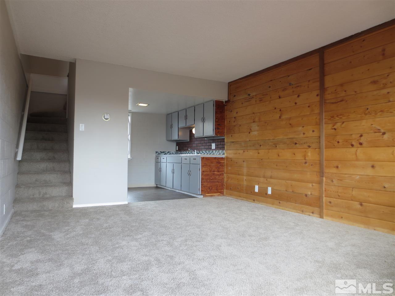 2133 Patton Drive Reno, NV 89512 - Photo 18 of 23 a view of an empty room with kitchen and a window
