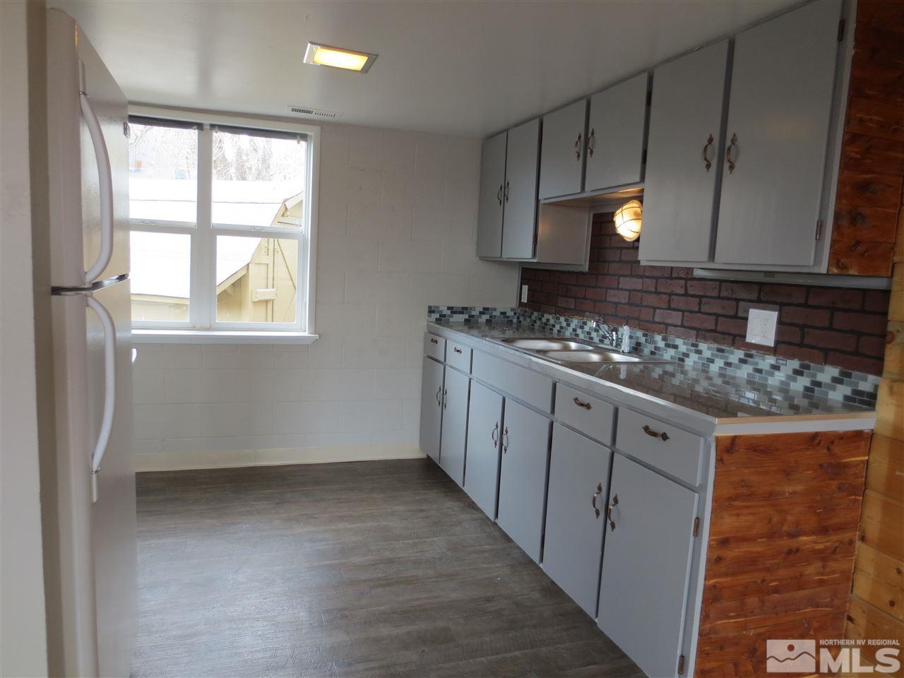 2133 Patton Drive Reno, NV 89512 - Photo 21 of 23 a kitchen with granite countertop a sink stove and cabinets