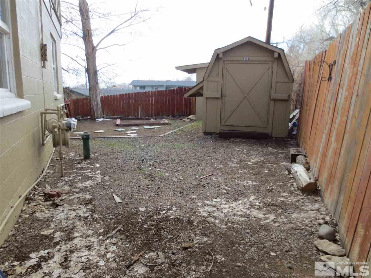2133 Patton Drive Reno, NV 89512 - Photo 23 of 23 a view of backyard with small cabin and wooden fencing