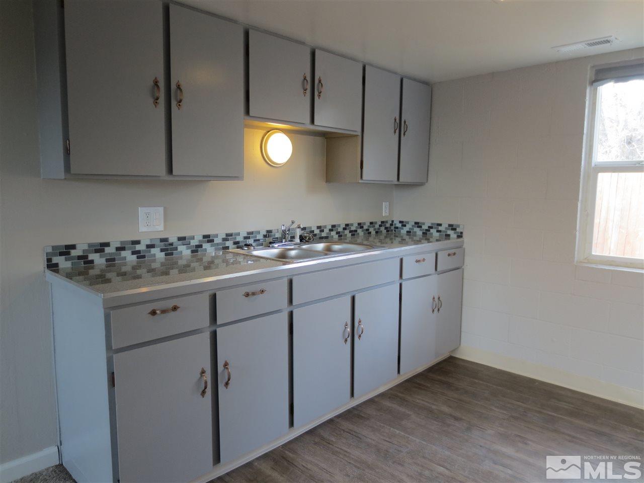 2133 Patton Drive Reno, NV 89512 - Photo 8 of 23 a kitchen with cabinets and window