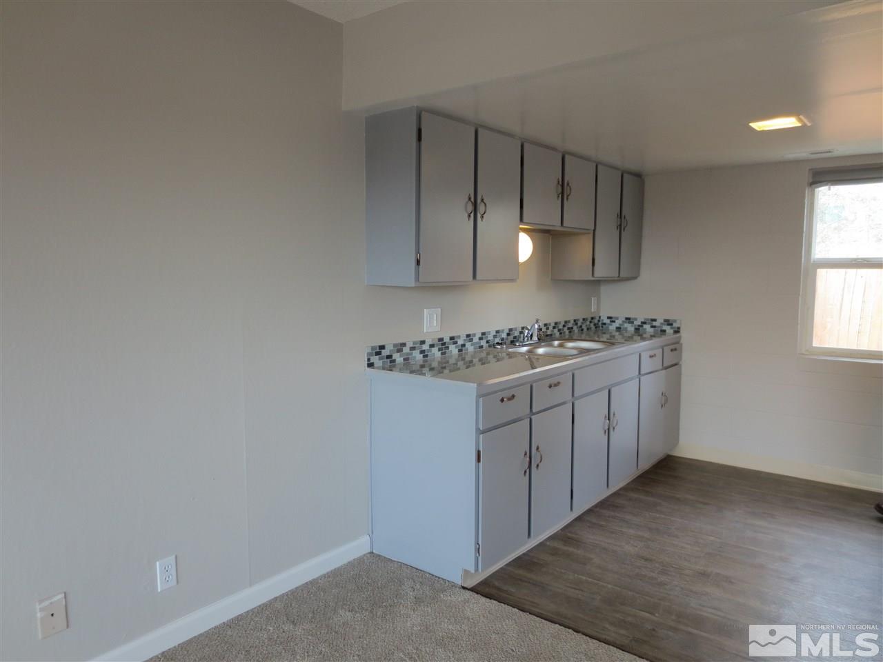 2133 Patton Drive Reno, NV 89512 - Photo 9 of 23 a kitchen with a sink a stove and cabinets